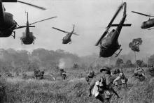 US Army helicopters fire into the tree line to cover South Vietnamese ground troops in March 1965